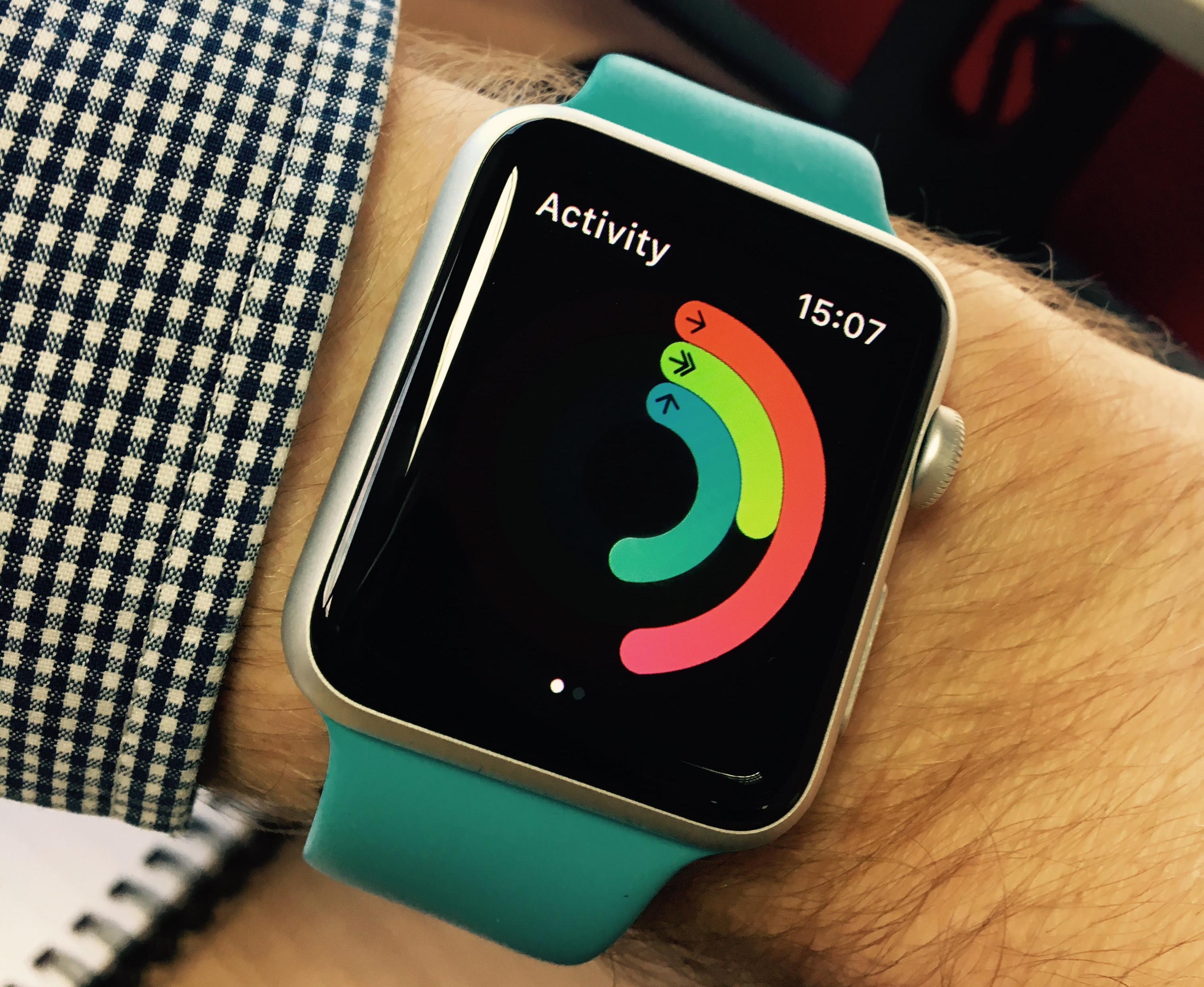 Photo of an Apple IWatch, showing the fitness tracker screen